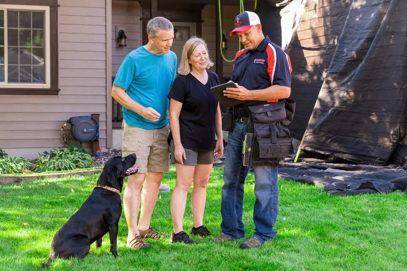 Zablocki Roofing reviewing a project with Central Minnesota homeowners